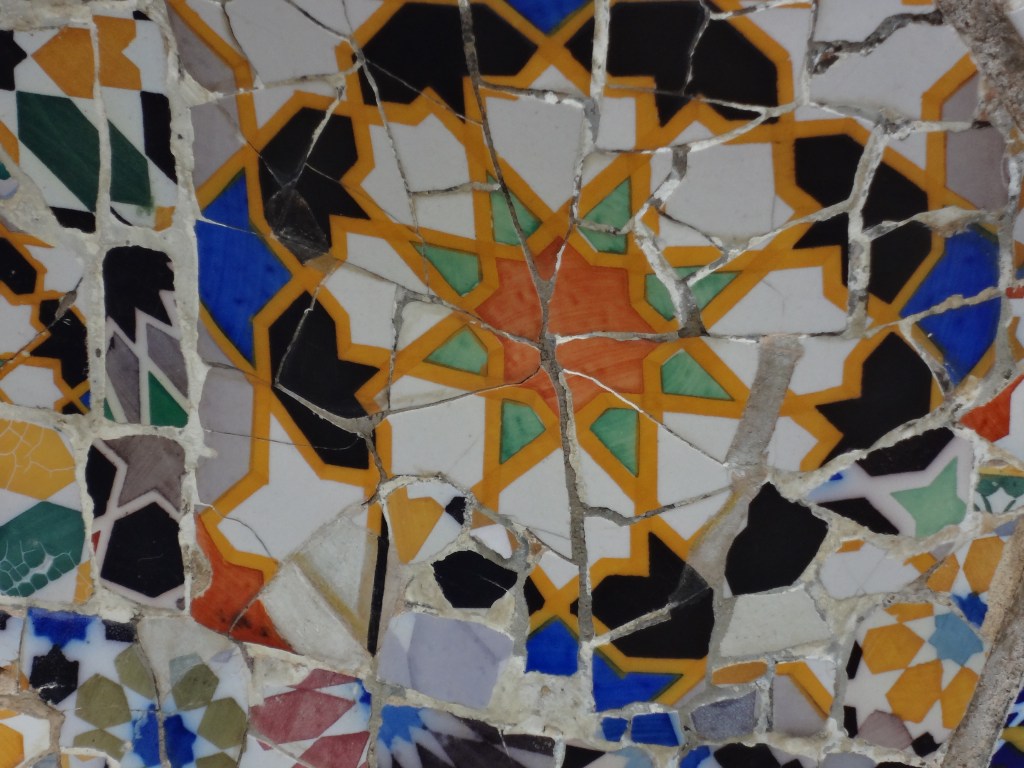 Smashed ceramic tiles rearranged into a new pattern.