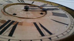 Large, looming clock face shows a time of around 2:15.